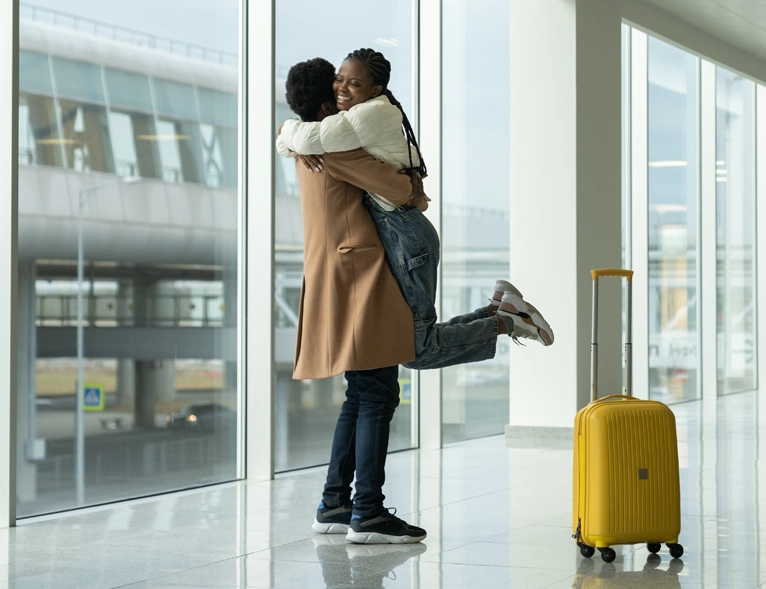 couple hugging at the airport